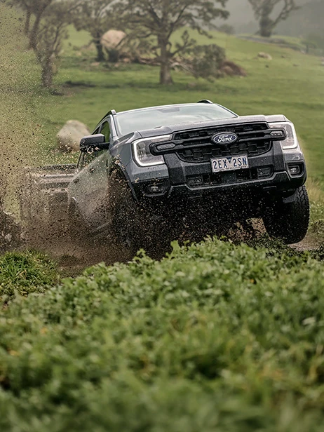 Truck splashing through mud