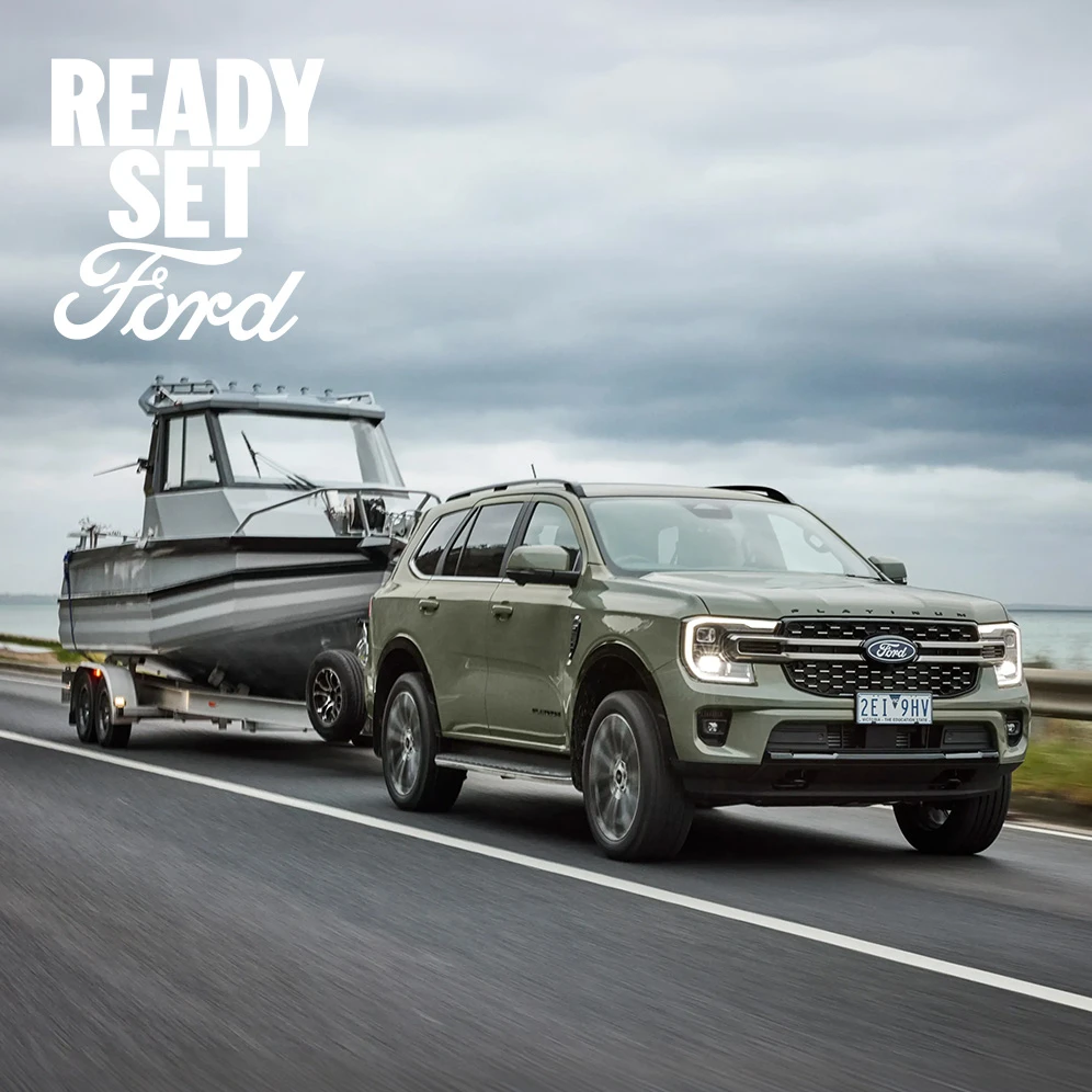 Ford suv towing a boat