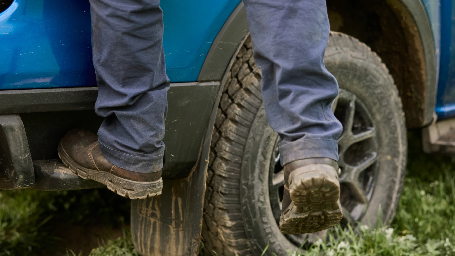 Man stepping on truck bed