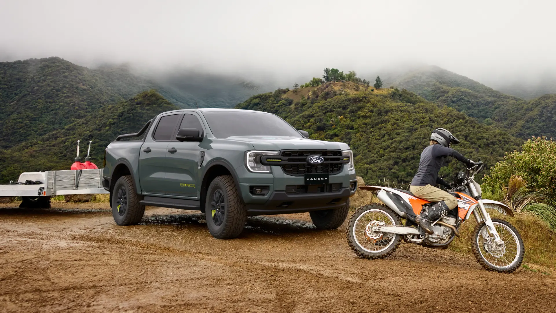 Grey truck and dirt bike