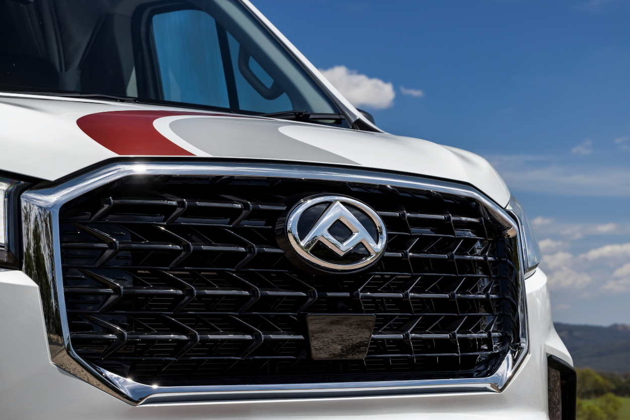Close-up of LDV Deliver 9 Motorhome front grille and badge, backed by 7-year factory warranty and 3-year roadside assist across Australia