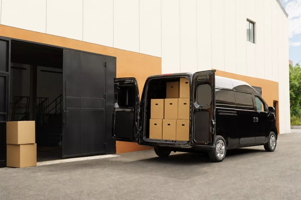 LDV eDeliver 5 short wheelbase electric van driving on the road showcasing up to 335km range