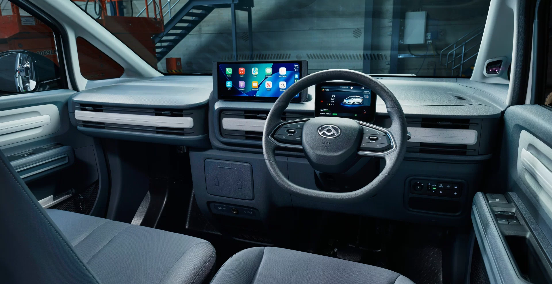 LDV eDeliver 5 driver cabin interior showing the steering wheel, dashboard and three-seat layout