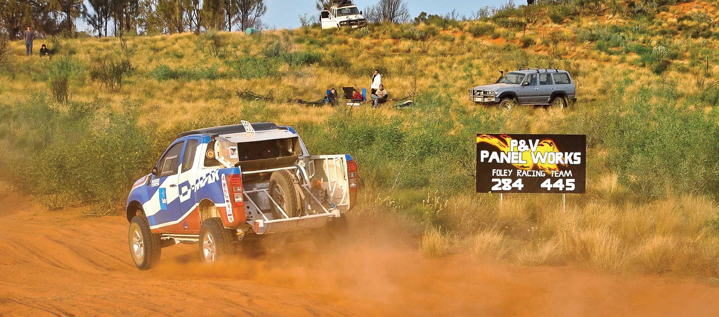 Fans watch the D-MAX tear across dusty race track 
