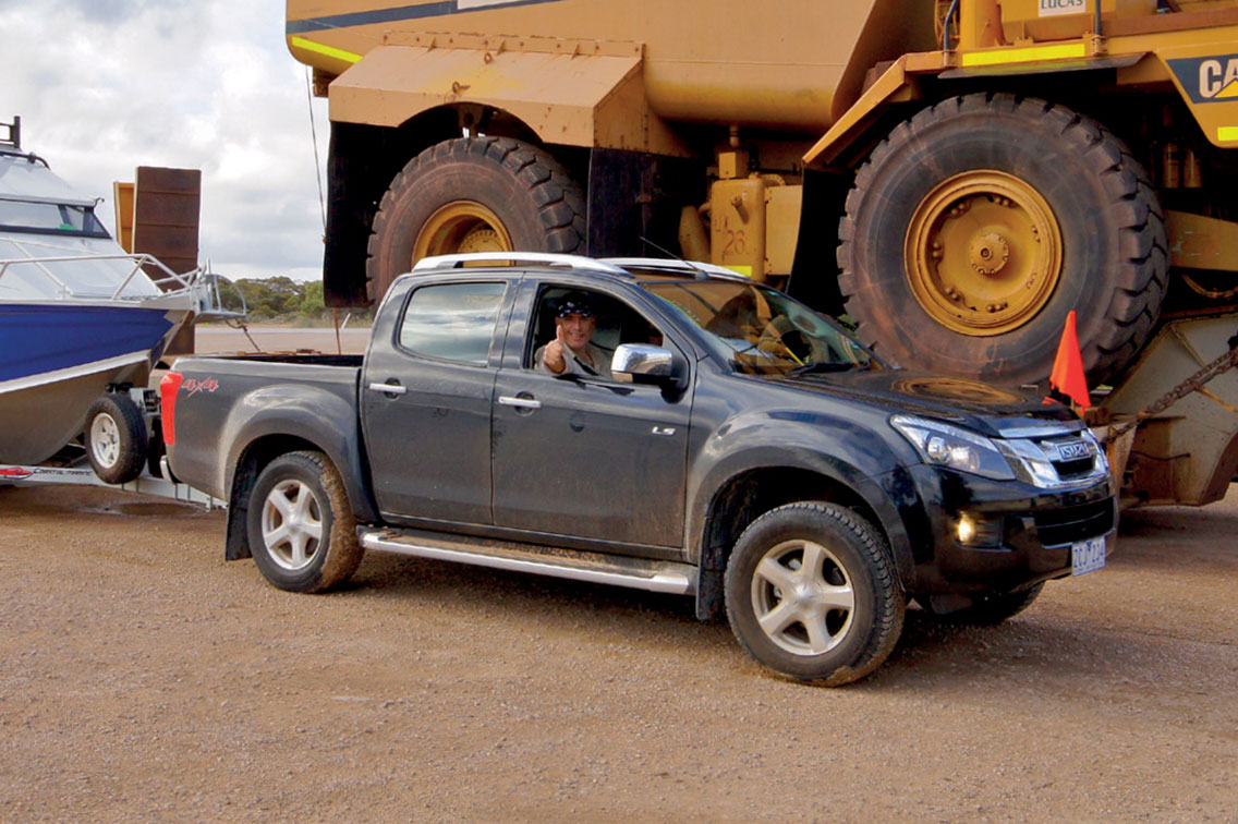 The Team's D-MAX parked next to a CAT Mining Truck