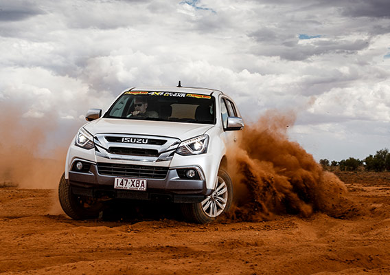 Isuzu MU-X skids on dusty track
