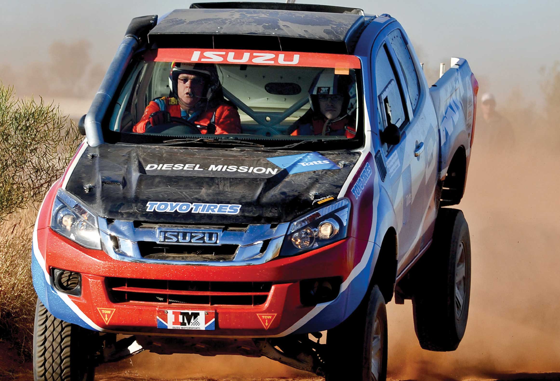 Action shot of the two drivers in the D-MAX airborne after jump 