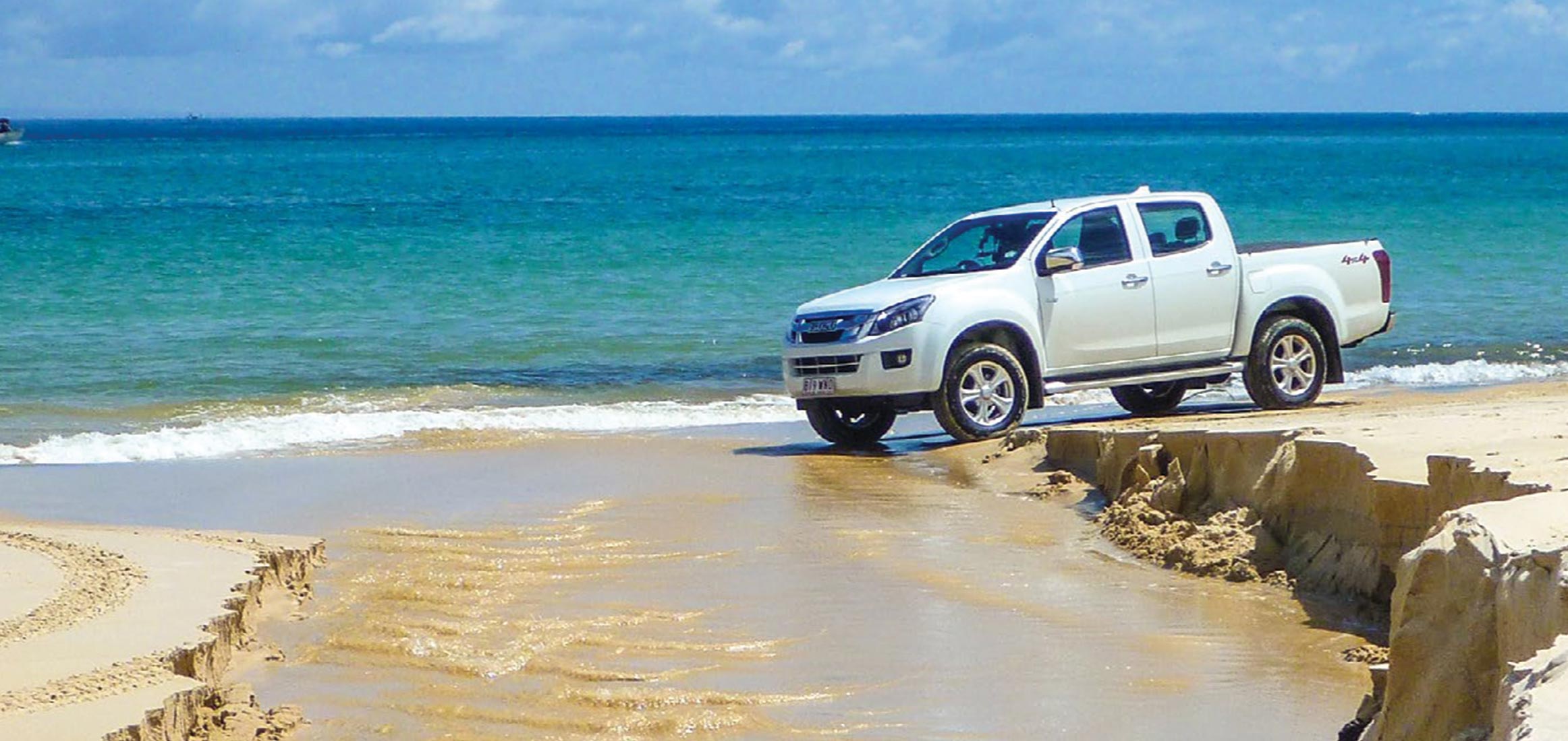 D-MAX drives across beach water crossing 