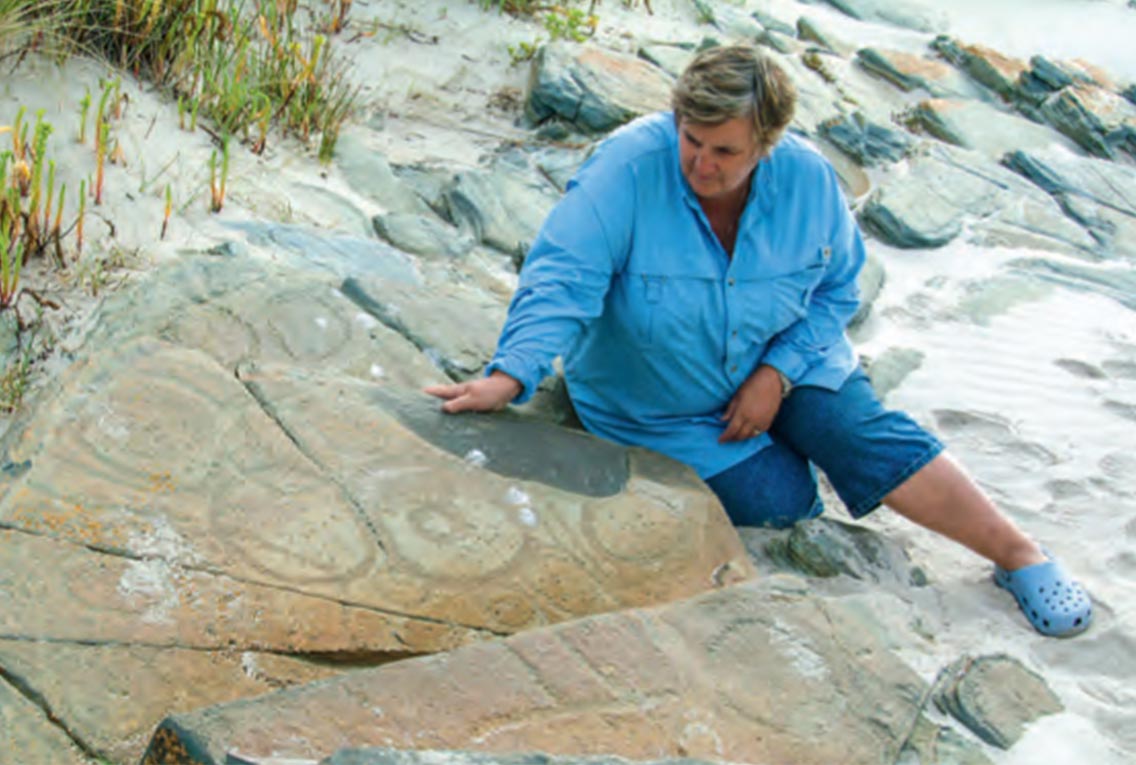 Rock carvings on beach