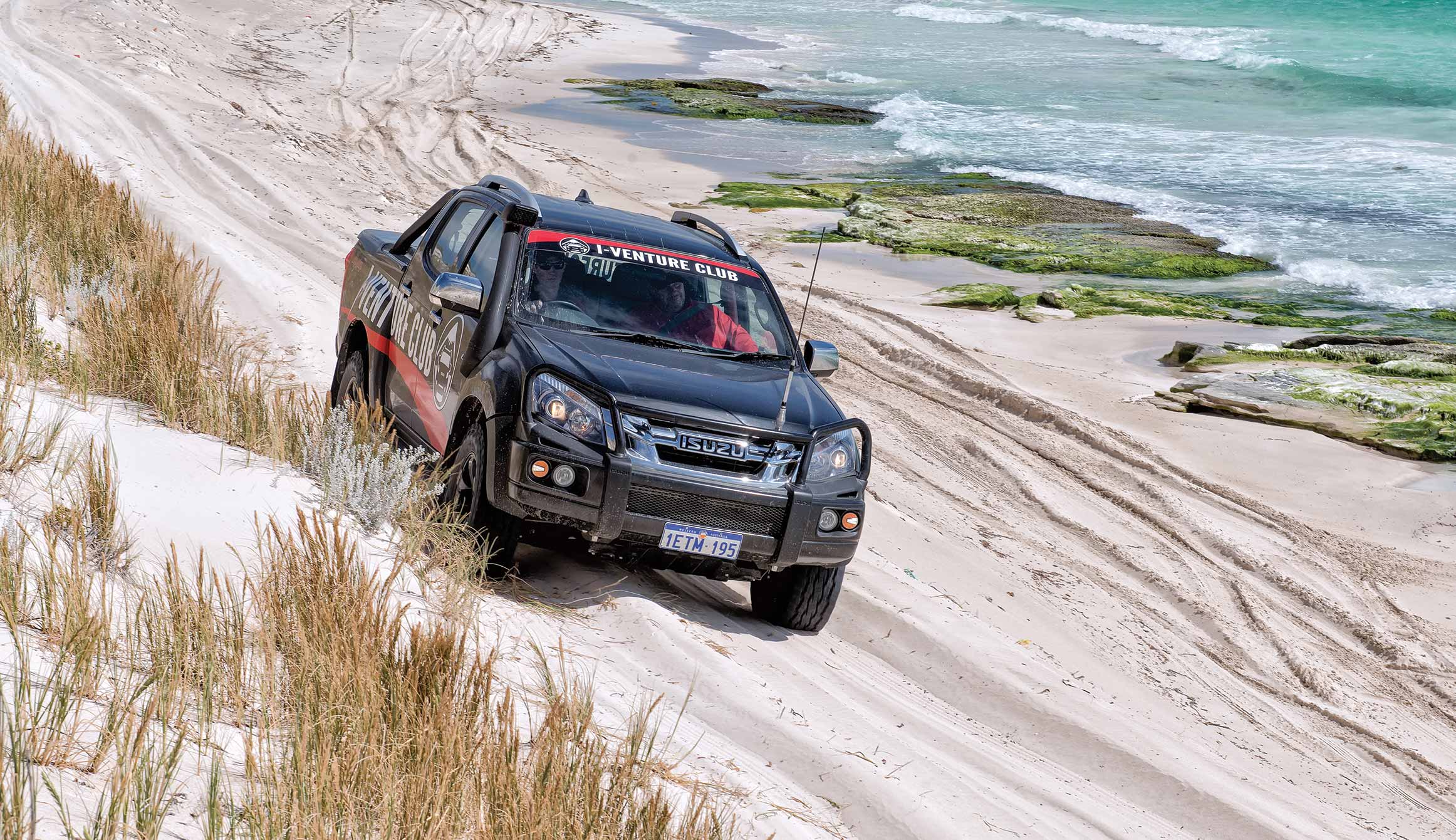 I-Venture Club D-MAX drives along sand dune