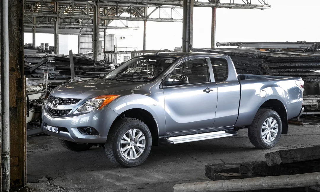 Silver second-generation Mazda BT-50 parked in a warehouse.