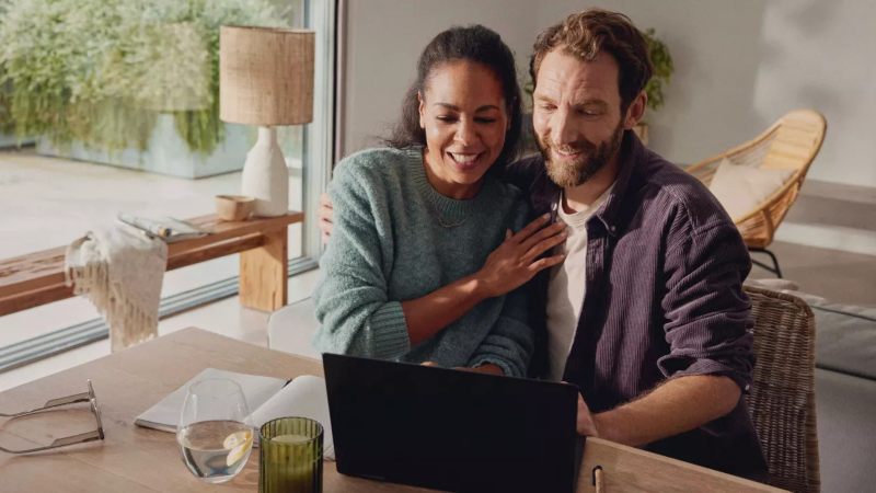 Couple looking at laptop together