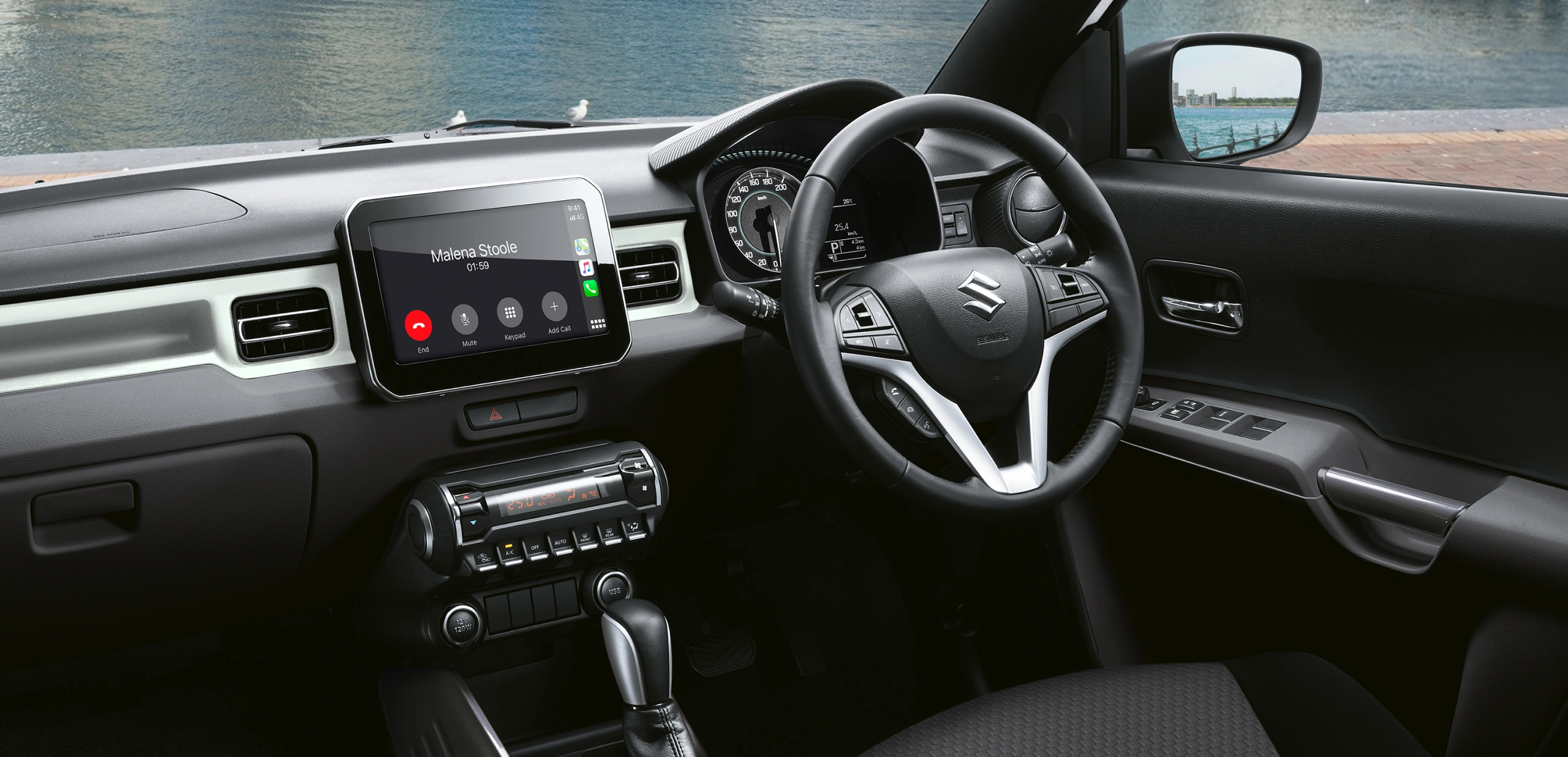Suzuki Ignis modern interior and dash featuring large touchscreen with smartphone connectivity through Apple CarPlay and Android Auto