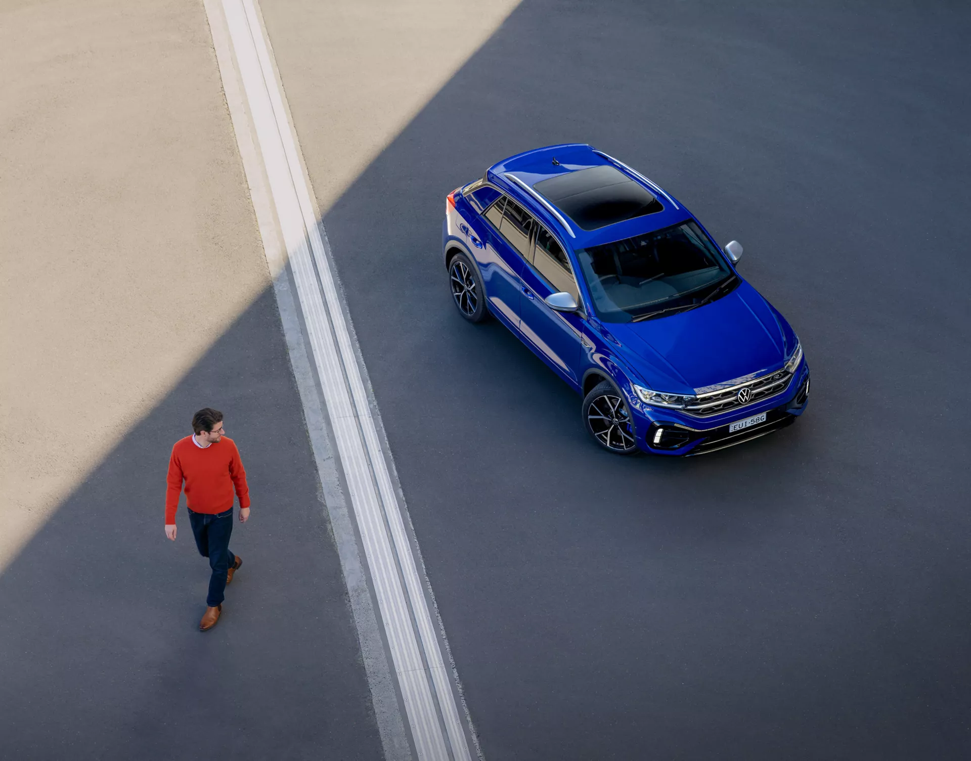 Top angle of the Man getting away the Volkswagen T-Roc R.
